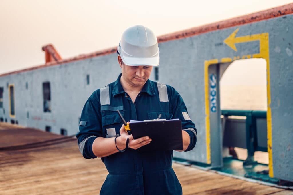 A man in a hard hat and uniform, ready for safety checks as one of the dedicated flag state inspectors.
